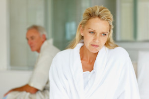 purch worried woman and hubby in bed 300x200